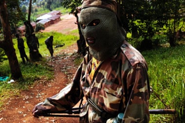A Rally for Congolese Democracy soldier on patrol in 2004